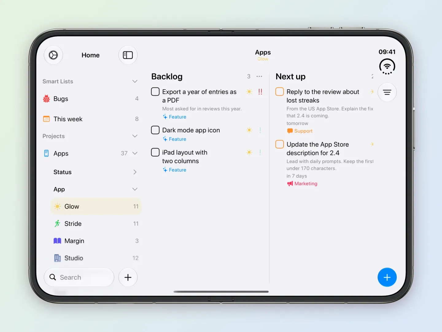 The Apps board on an unfolded iPhone Duo filtered to Glow, selected under App in the sidebar with 11 tasks. Backlog holds Export a year of entries as a PDF, Dark mode app icon and iPad layout with two columns, and Next up holds Reply to the review about lost streaks and Update the App Store description for 2.4.